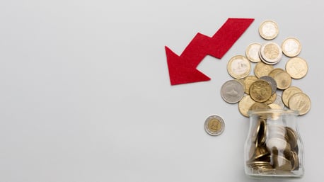 fallen-economy-and-jar-with-coins_1000x562
